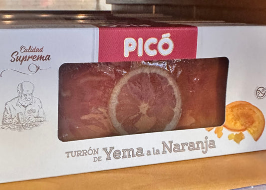 Picó Turrón de Yema a la Naranja Calidad Suprema – spanischer Orangen-Turrón mit kandierter Orangenscheibe in weiß-roter Originalverpackung